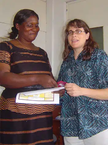 Elisabeth receives her diploma from Beth.