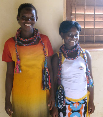 Two Ajumako producers modeling their braided necklace samples