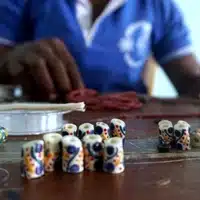 Global Mamas Beading Workshop assembling a fair trade bracelet