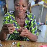 Beading Workshop at Global Mamas assembling a fair trade ornament