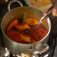 Global Mamas Cooking Workshop frying plantain to make red red