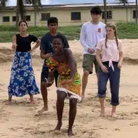 Global Mamas Drumming & Dancing Workshop dancing on the beach in Cape Coast