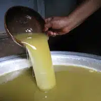 Soapmaking Workshop at Global Mamas getting the shea butter ready for pouring